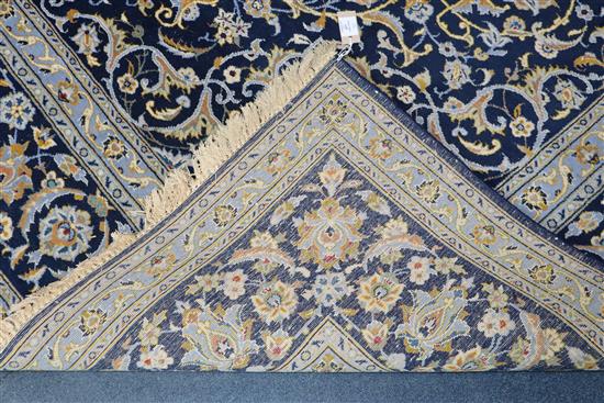 A Tabriz style blue ground carpet 388 x 279cm